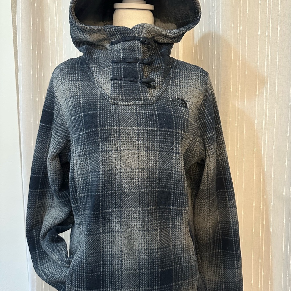 The North Face, gray and navy blue, fleece pullover jacket.